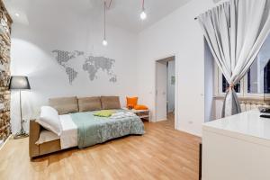 a bedroom with a bed and a world map on the wall at TRASTEVERE SUITE EXPERIENCE in Rome