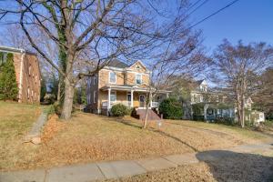 a house with a tree in the yard at Cozy Roanoke Vacation Rental 2 Mi to Downtown! in Roanoke