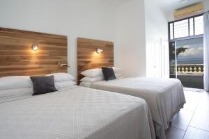 Postel nebo postele na pokoji v ubytování Pura Vista Hotel