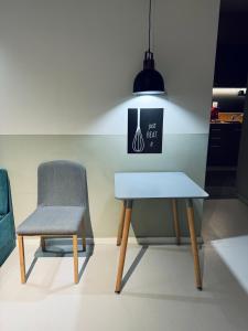 a table and a chair in a room at E2G URBAN STAY #G1 in Thessaloniki