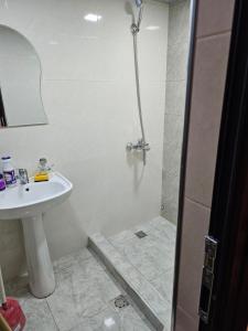 a bathroom with a sink and a shower at Квартира отдыха in Ijevan