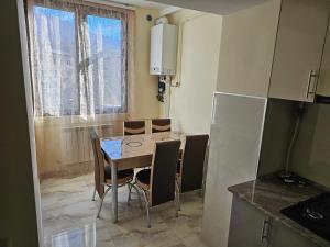 a kitchen with a table and chairs in a room at Квартира отдыха in Ijevan