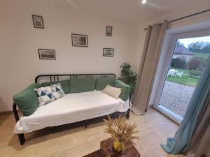 Postel nebo postele na pokoji v ubytování La Charmille