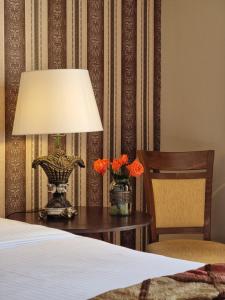 Postel nebo postele na pokoji v ubytování Likoria Hotel