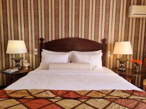 Postel nebo postele na pokoji v ubytování Likoria Hotel