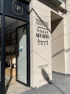 a front door of a store with a sign on it at Departamento céntrico BELGRANO in San Salvador de Jujuy