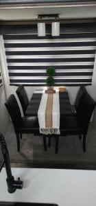 a black couch with a table in front of a window at So "Time to Wander" A pet friendly beach retreat in Fort Myers