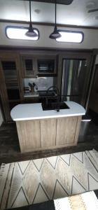 a kitchen with a large white sink in a room at So "Time to Wander" A pet friendly beach retreat in Fort Myers