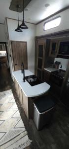 a kitchen with a sink and a counter top at So "Time to Wander" A pet friendly beach retreat in Fort Myers