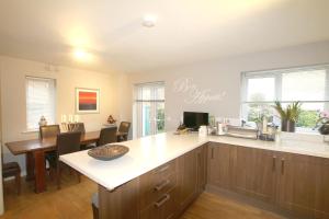 a kitchen with a sink and a counter top at 2 Friends Close in Kent