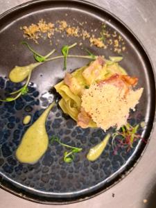 a plate of food with pasta and sauce on it at Hotel Butterfly Wellness & Spa in Rimini