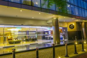 a large building with a shopping mall with lights at Jose Antonio Deluxe in Lima +38 photos