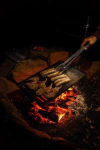 a grill with a bunch of food on it at Kestrel Nest EcoHut in Mount Adrah