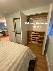 a bedroom with a bed and a closet at Cozy Garden Apt in Williamsburg NYC Townhouse in Brooklyn