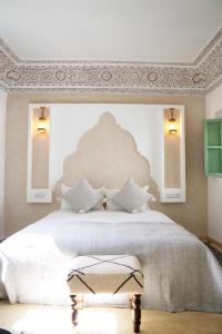 Postel nebo postele na pokoji v ubytování Riad Chic