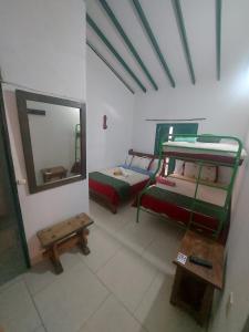 Een bed of bedden in een kamer bij POSADA CASA MIA