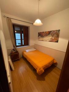 מיטה או מיטות בחדר ב-Aires de gredos/bajo
