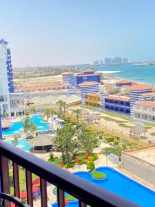 a view of a resort from a balcony at شاليه للإيجار في بورتو مارينا الساحل الشمالي العلمين 34 in El Alamein
