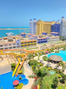 an aerial view of a water park in a resort at شاليه للإيجار في بورتو مارينا الساحل الشمالي العلمين 34 in El Alamein