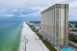 an aerial view of a beach with a large building at Tidewater Beach Resort in Panama City Beach