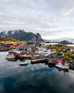 an aerial view of a harbor with boats in the water at Maybua by May's in Reine