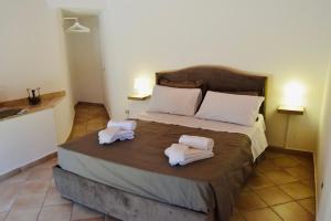 Giường trong phòng chung tại Casa Vacanze Vicolo Palaù