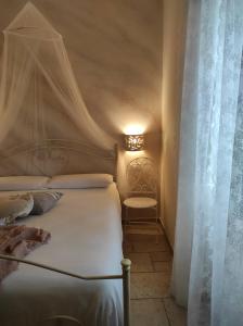 Ліжко або ліжка в номері Lo splendore dei Sassi