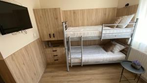 Postel nebo postele na pokoji v ubytování Levendula Vendégház