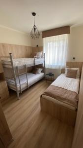 Postel nebo postele na pokoji v ubytování Levendula Vendégház