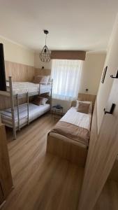 Postel nebo postele na pokoji v ubytování Levendula Vendégház