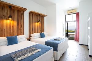 Postel nebo postele na pokoji v ubytování Pura Vista Hotel