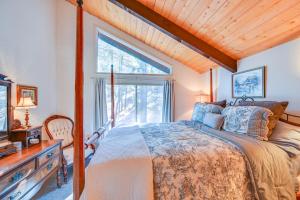a bedroom with a bed and a window at Munds Park Cabin with Deck and Golf Course Views in Munds Park
