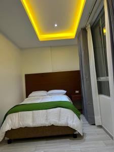 Una cama o camas en una habitación de EL ALAMO, EJECUTIVO Y SPA