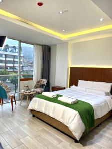 Cama ou camas em um quarto em EL ALAMO, EJECUTIVO Y SPA