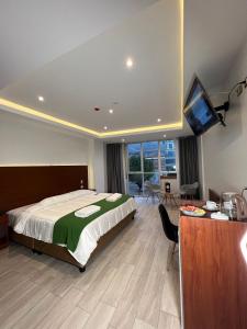 Cama ou camas em um quarto em EL ALAMO, EJECUTIVO Y SPA