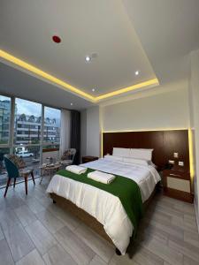 Cama ou camas em um quarto em EL ALAMO, EJECUTIVO Y SPA