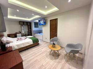 Cama ou camas em um quarto em EL ALAMO, EJECUTIVO Y SPA