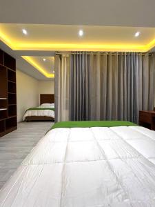 Cama ou camas em um quarto em EL ALAMO, EJECUTIVO Y SPA