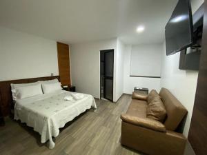Sjónvarps- og/eða afþreyingartæki á Hotel Yolima Real
