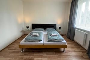 Postel nebo postele na pokoji v ubytování Apartments Gala Abertamy