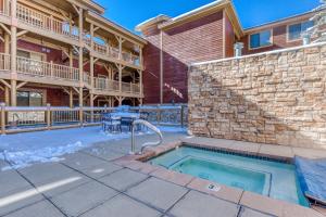 a house with a swimming pool and a patio at Black Bear Lodge in Park City
