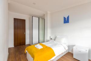 Postel nebo postele na pokoji v ubytování Sunny Hotel Tbilisi