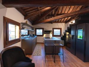 a kitchen with black cabinets and a counter top at LaLux Venezia in Venice