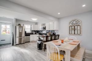 a kitchen and dining room with a table and chairs at Remodeled Ocean City Getaway with Harbor Views! in Ocean City