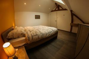 Ένα ή περισσότερα κρεβάτια σε δωμάτιο στο L'Atypique Vosgien