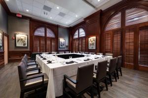a large conference room with a large table and chairs at Hilton Naples in Naples