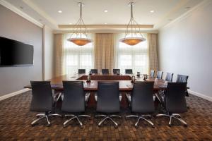 a conference room with a large table and chairs at Hilton Naples in Naples