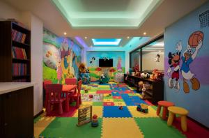 a childs room with a mickey mouse mural at Radisson Blu Resort, Goa in Cavelossim