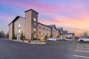 a rendering of a building with a parking lot at Best Western Bend North in Bend