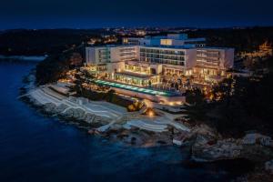 an aerial view of a hotel at night at Grand Hotel Brioni Pula, A Radisson Collection Hotel in Pula